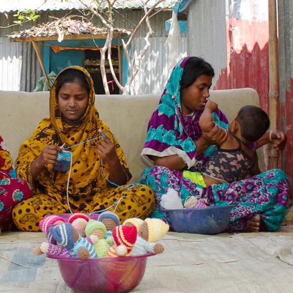 Artisans crocheting together, rural Bangladesh